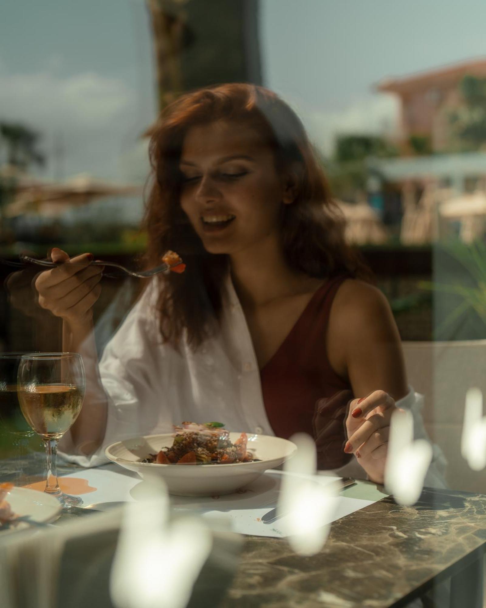 Sundia Exclusive By Liberty Fethiye Adults Only Hotel Exterior photo A woman eating